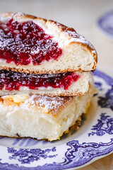 raspberry and blueberry cbrioche bun with custard and cranberries
