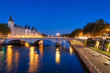 Cityscape of Paris by the Seine river at down. France