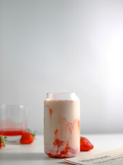 Strawberry milk on a white background, space for a text.
