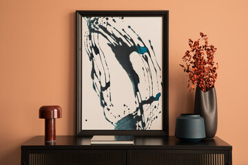 Minimalist composition of living room interior with mock up poster frame, black vase with red dried...