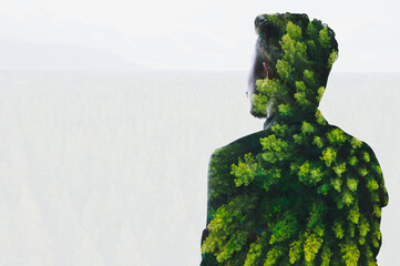 the double exposure image of the businessman thinking and overlay with pines images. the concept of state of mind, meditation, depression and people