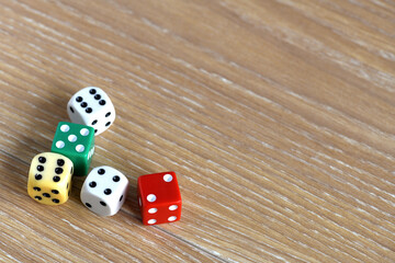 Old coloured dice on a table
