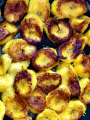 Frying plantain, when cooking, in a frying pan, acquires a golden yellow color