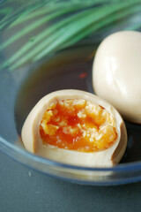 soy sauce marinated egg in a bowl .