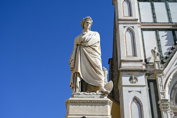 Florence, Italy: Statue Dante Alighieri in Piazza Santa Croce. Monument to Dante Alighieri in front of Basilica of Santa Croce in Firenze.