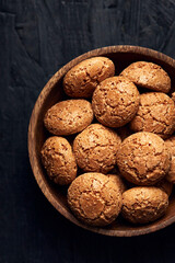 Italian amaretti almond cookies in a wooden bowl