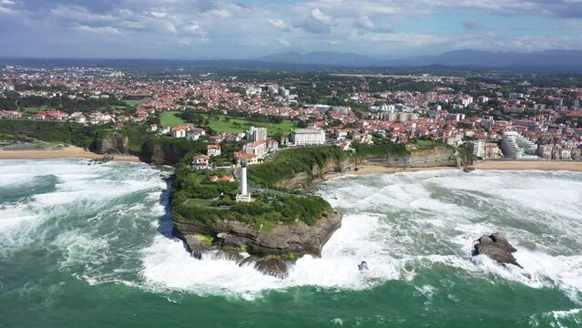 Beautiful Biarritz lighthouse surf destination aerial shot sunny day 