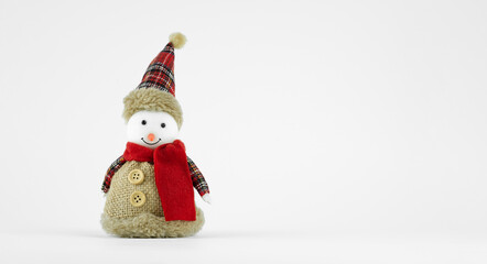 Handmade funny snowman with a fabric suit on white background
