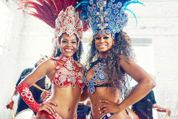 Brazilian dancers, carnival or women in party costume with feather accessory or glitter bra in...