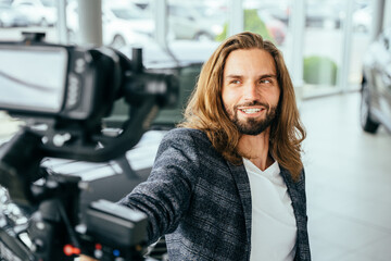 Social media influencer creating content. man shooting video of himself using camera on tripod....