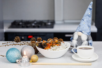 Plate with rice noodles and chicken. Festive table decoration. Dark home kitchen background. Christmas concept