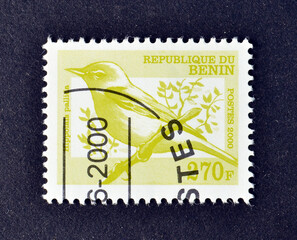 Cancelled postage stamp printed by Benin, that shows Eastern Olivaceous Warbler (Hippolais...
