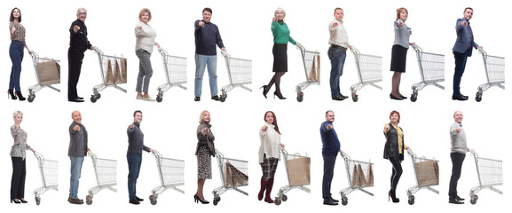 a group of people with a shopping cart point their finger at the camera