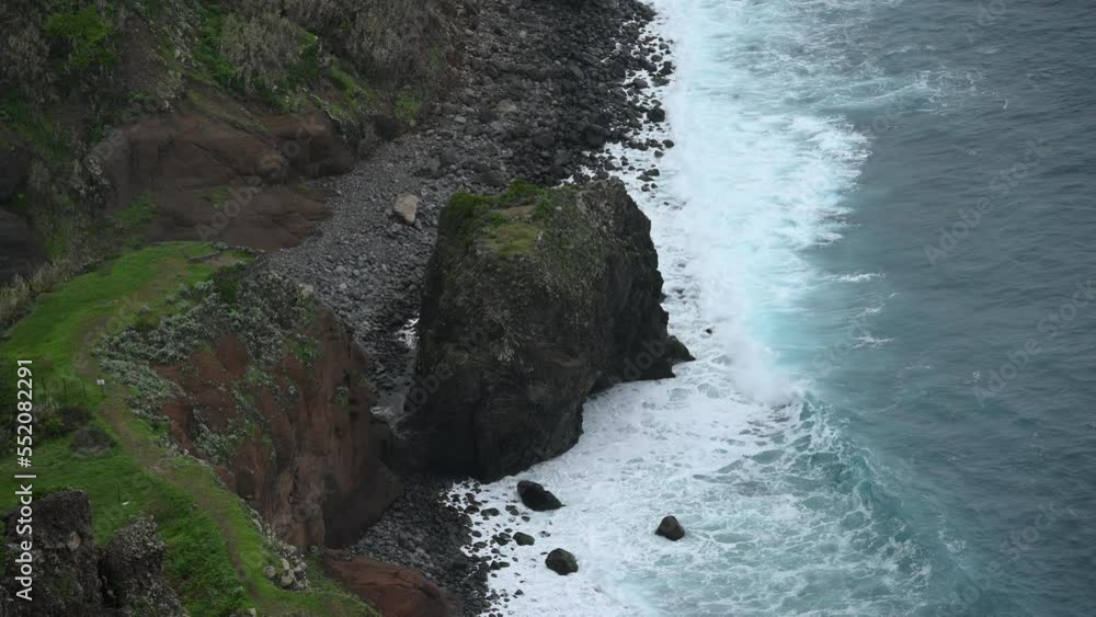 Wall mural view of waves crashing on rocks. storm at atlantic ocean, madeira island shore