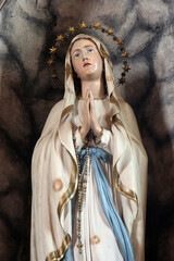 Our Lady of Lourdes, statue in the parish church of the Holy Three Kings in Karlovac, Croatia - 552082668