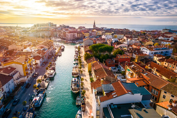 Town of Grado colorful architecture and channels aerial sunset view