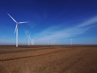 Agricultural field full of wind turbines