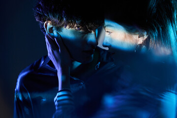 Young couple in neon light