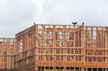 Structural wooden frame of apartment building under construction