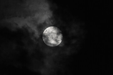 full moon covered by clouds