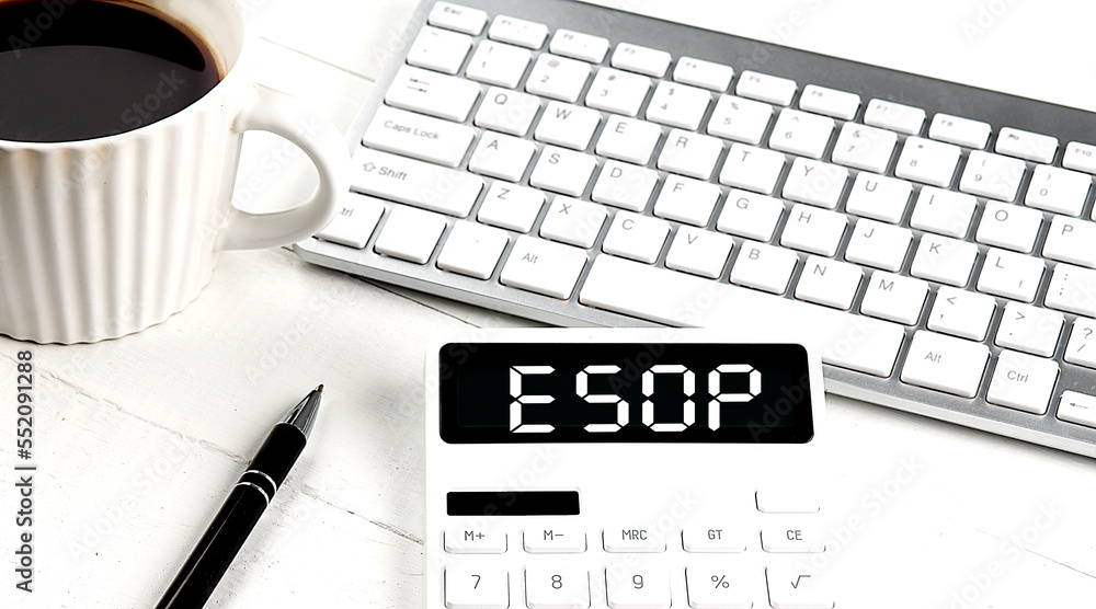 Poster esop text on a calculator with keyboard and coffee