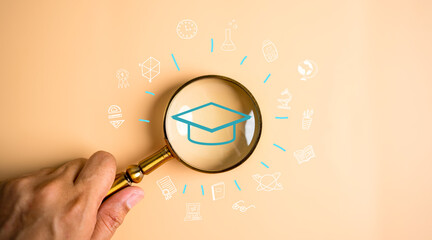 Magnifier focus to graduate cap icon with learning educate, study knowledge to creative thinking idea and problem solving solution, E-learning online education course degree certificate.