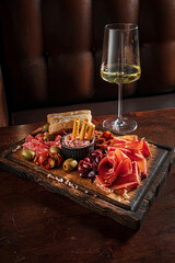 meat appetizer and white wine