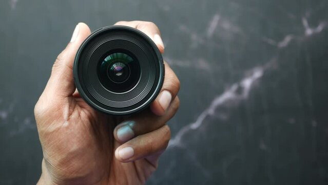 top view of holding a camera lenses 