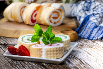 Slices of homemade sweet roll with fruit jam.