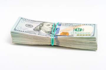 Stack of dollars. One hundred dollars banknotes on white background