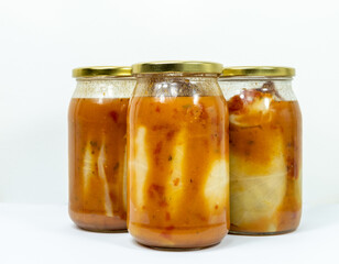 Stuffed cabbage in a jar with tomato sauce - concept of homemade preserves without background