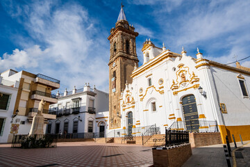 Charming Andalusian square with church in small town, Bullullos Par del Condado, Spain