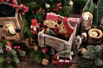 Christmas still life with old teddy bears in wooden box on the table in rustic style