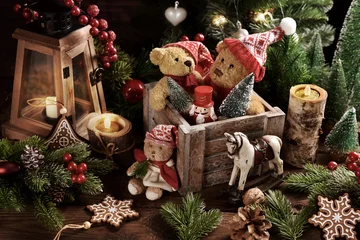 Fotobehang Christmas still life with old teddy bears in wooden box on the table in rustic style © teressa