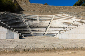 Odeon a classic greek open-air theatre.
Old theater with marble seats and stairs. The Acropolis of Rhodes. Monte Smith Hill, Rhodes island, Greece