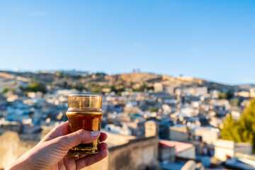 Delicious traditional mint tea drunk with the view at historic downtown called medina in Fez, Morocco.