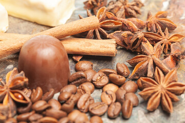 chocolate candies with anise,cinnamon sticks,coffee beans.