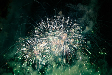 green fireworks with black sky