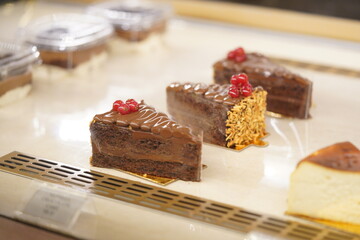 Delicious chocolate cakes on the display window at the restaurant.