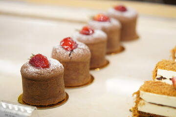 Delicious chocolate cakes on the display window at the restaurant.