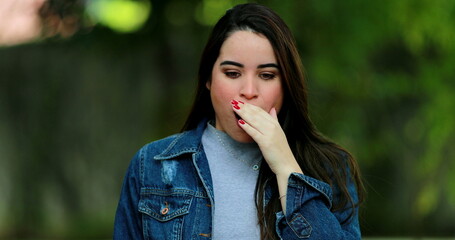 Fototapeta premium Young woman receiving bad news. Girl emotion reaction negative reaction
