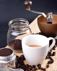 Coffee cup and tool on table, High angle view