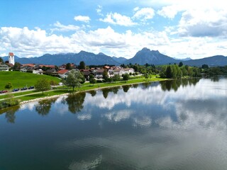 Hopfensee lake and town Hopenfen Swabia  Bavaria Germany drone aerial view