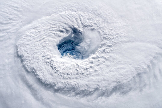 Aerial view of a category 4 hurricane seen from space. The center, known as the eye of the hurricane, is clearly visible. Digitally enhanced. The elements of this image furnished by NASA.