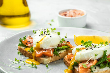 Toast with salmon, poached egg and avocado guacamole, Ketogenic diet. Low carb high fat breakfast. Healthy food concept. place for text, top view