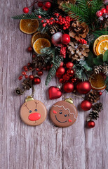 Christmas holiday background. Gingerbread cookies and beautiful Decorations on rustic wooden table close up. symbol of festive winter season. top view. copy space