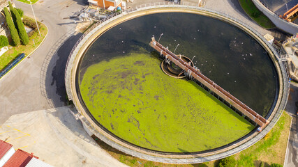 Aerial view of the tanks of a sewage and water treatment plant enabling the discharge and re-use of waste water. It's a sustainable water recycling with treatment plant.