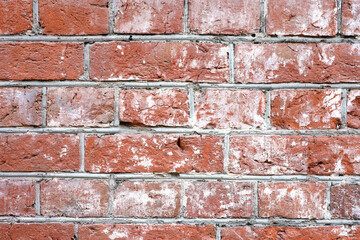 Red brick wall texture. Old facade of a building with concrete joints, vintage background