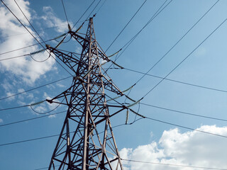 High-voltage power transmission tower connecting multiple lines.