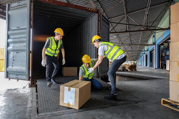Worker carry carton box taken from 40 feet steel container got accident drop box to floor injury